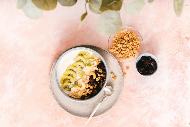 a bowl of oatmeal sitting on top of a plate, by Julia Pishtar, trending on pexels, hurufiyya, kiwi fruit, vanilla smoothie explosion, styled food photography, thumbnail