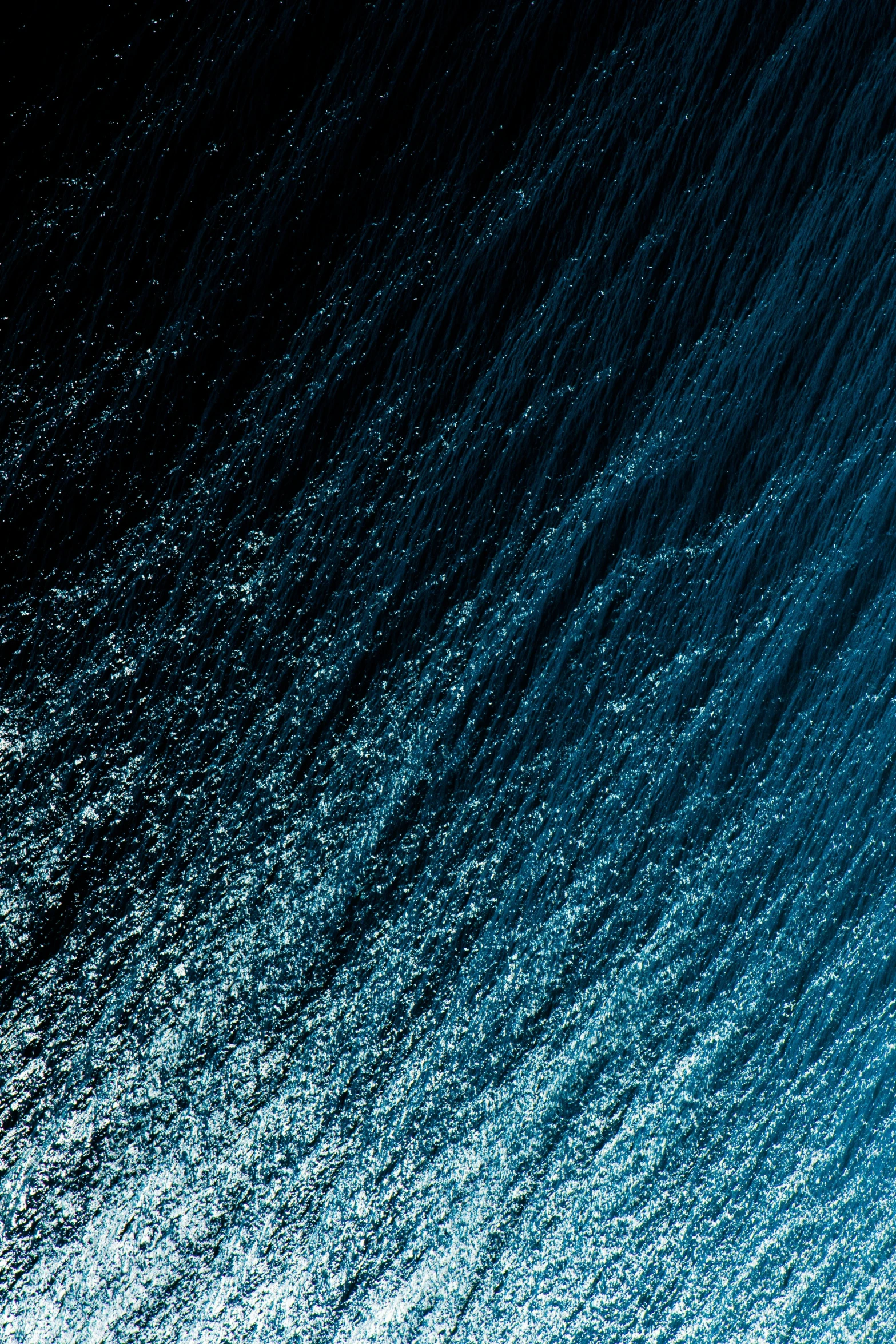 a man riding a wave on top of a surfboard, an album cover, trending on unsplash, ferrofluid oceans, the blue whale crystal texture, midnight blue, blue: 0.5