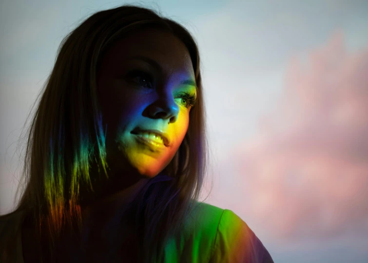 a woman with a rainbow light on her face, a portrait, pexels contest winner, synchromism, young woman looking up, wide view cinematic lighting, backlight photo sample, colour led