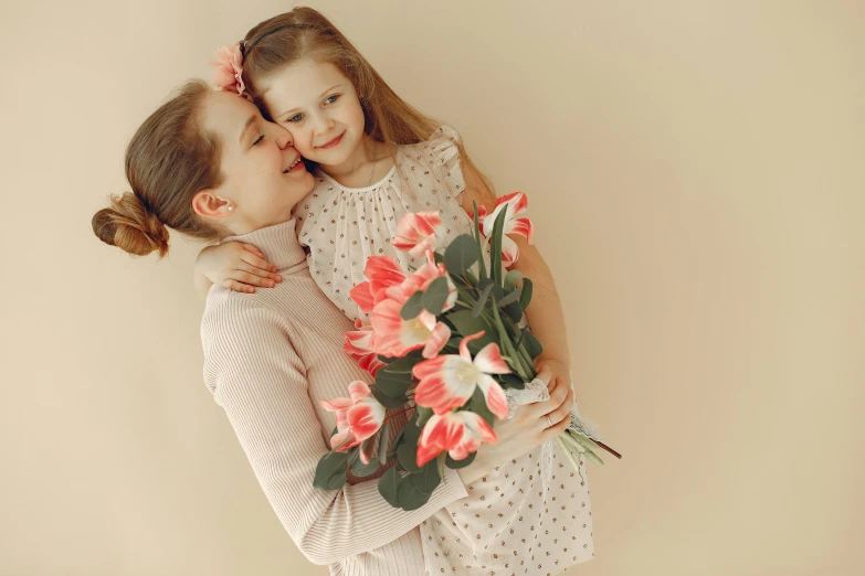 a woman standing next to a little girl holding a bouquet of flowers, pexels, art nouveau, sweet hugs, on a pale background, your mom, thumbnail