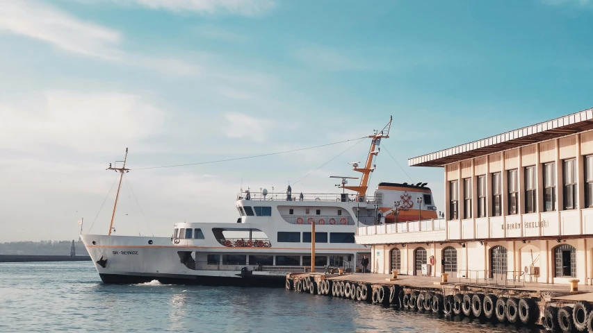 a large white boat sitting on top of a body of water, pexels contest winner, hurufiyya, city docks, fallout style istanbul, 🚿🗝📝