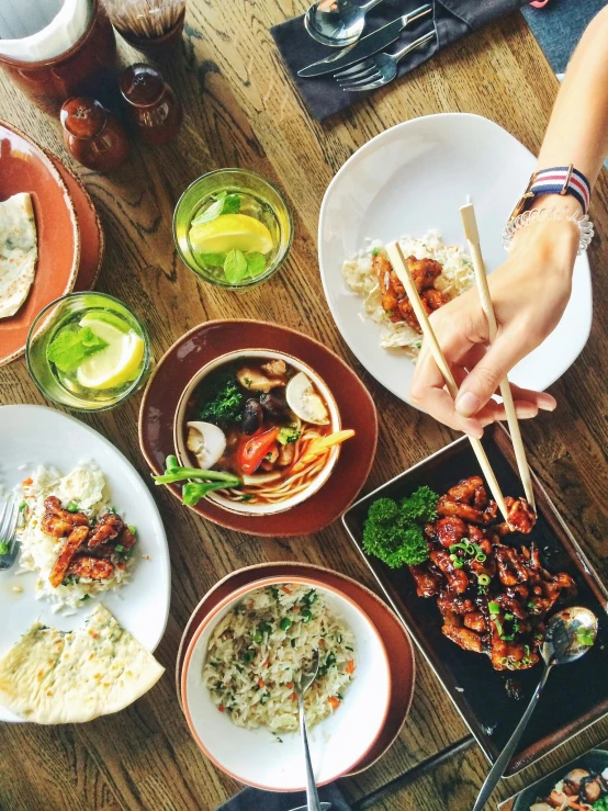 a wooden table topped with plates of food and chopsticks, pexels contest winner, renaissance, square, thumbnail, south east asian with long, 15081959 21121991 01012000 4k