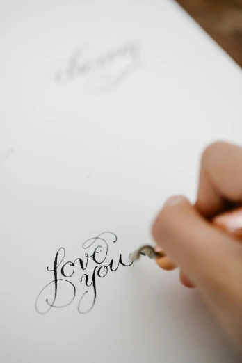 a person writing on a piece of paper with a pen, by Robbie Trevino, letterism, wedding, 4 k drawing, love craft, immaculate detail