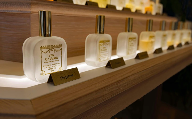 a row of perfume bottles sitting on top of a shelf, inspired by Giuseppe Camuncoli, renaissance, straya, the store, vanilla, thumbnail