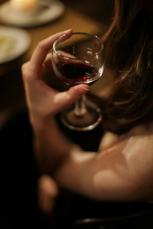 a close up of a person holding a wine glass, inspired by Nan Goldin, renaissance, barrel chested, flirty, trending photo, 278122496