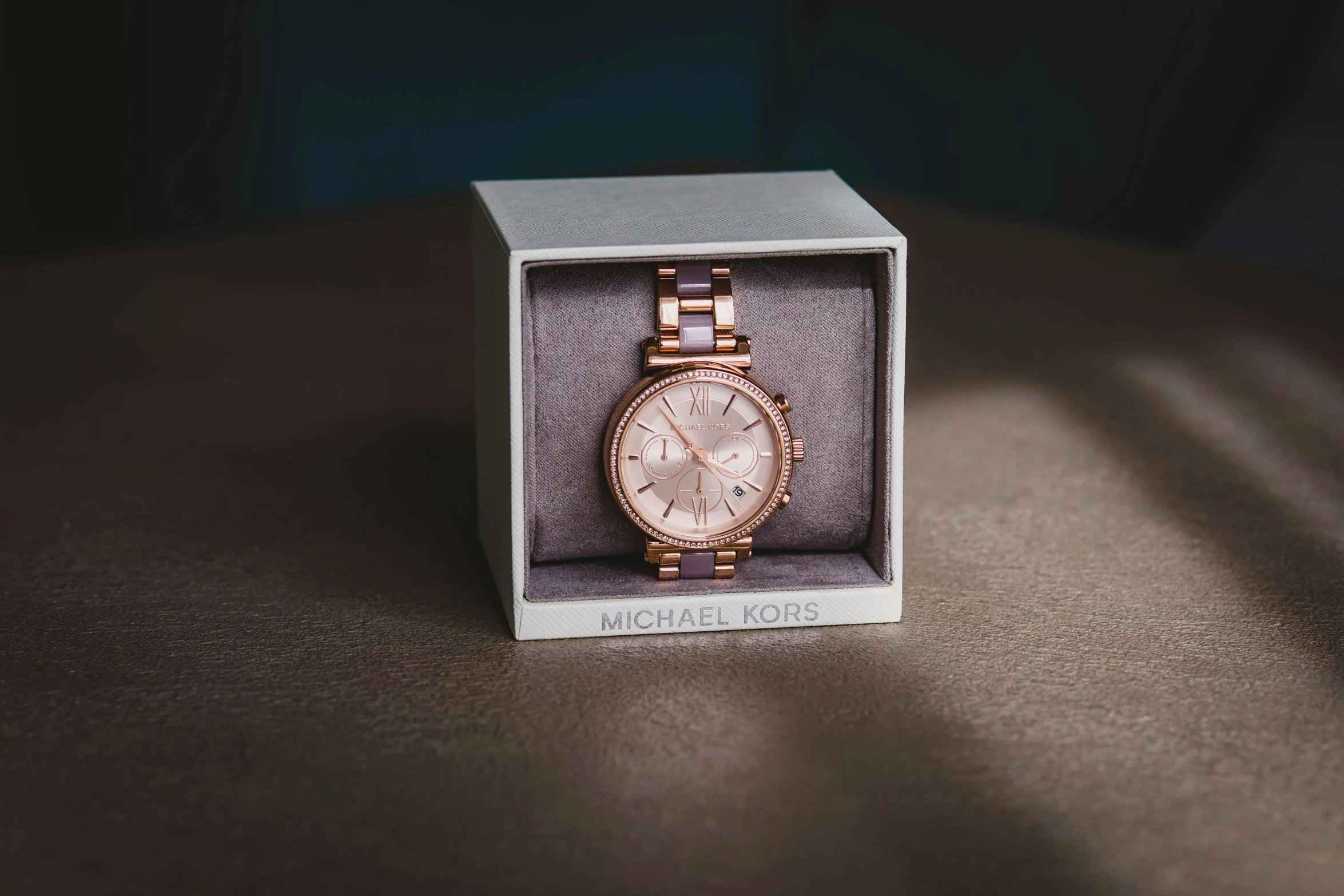 a watch in a box on a table, a portrait, pexels contest winner, michael kors, gradient pink, full body close-up shot, thumbnail