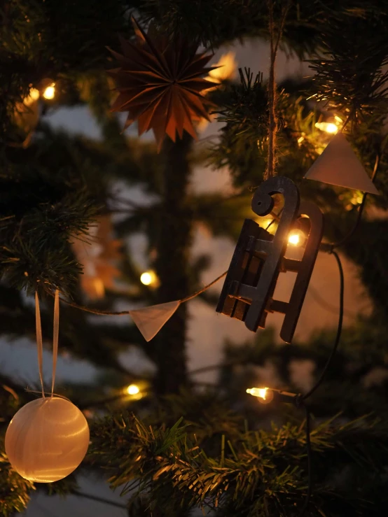 a close up of a christmas tree with lights, inspired by Ernest William Christmas, boat with lamp, cyber copper spiral decorations, scandinavian style, two moons lighting