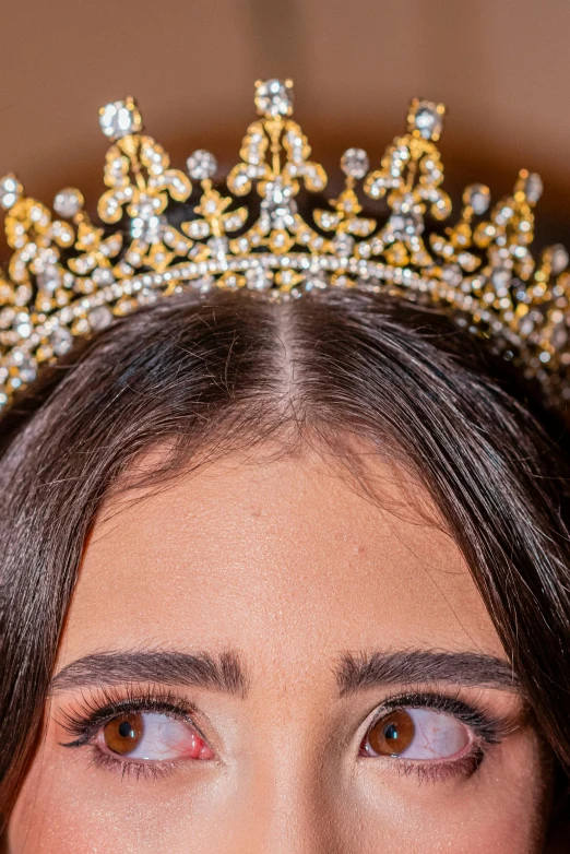 a close up of a woman wearing a crown, an album cover, by Robbie Trevino, trending on pexels, renaissance, young middle eastern woman, miss universe, looking straight, slide show