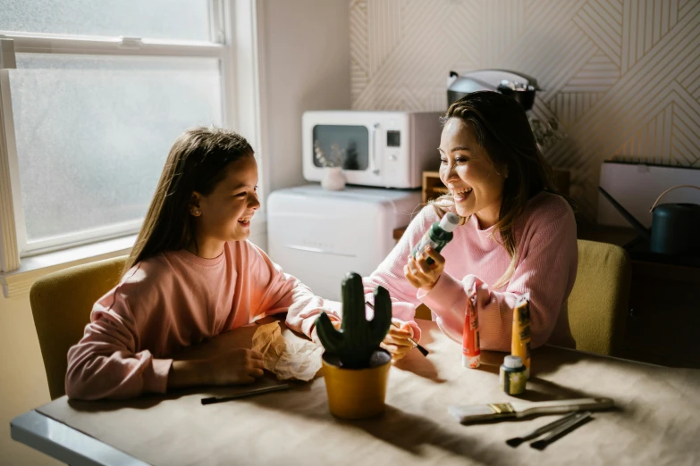 a couple of girls that are sitting at a table, pexels contest winner, process art, toothpaste refinery, at home, super cute and friendly, avatar image