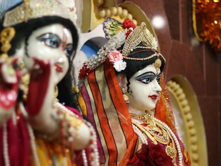 a couple of statues sitting next to each other, a picture, samikshavad, avatar image, wearing ornate clothing, a close up shot, full colour