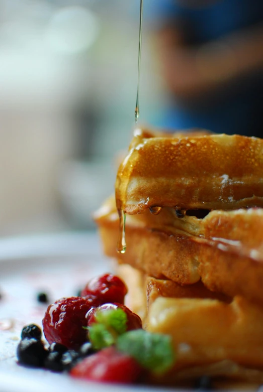 a stack of waffles sitting on top of a white plate, by Matt Stewart, pexels contest winner, banner, chile, toast, candid shot