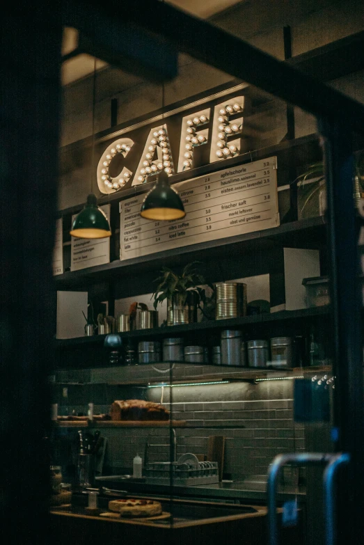 a view of a coffee shop through a window, inspired by Elsa Bleda, trending on unsplash, lights off, bright signage, profile image, restaurant menu photo