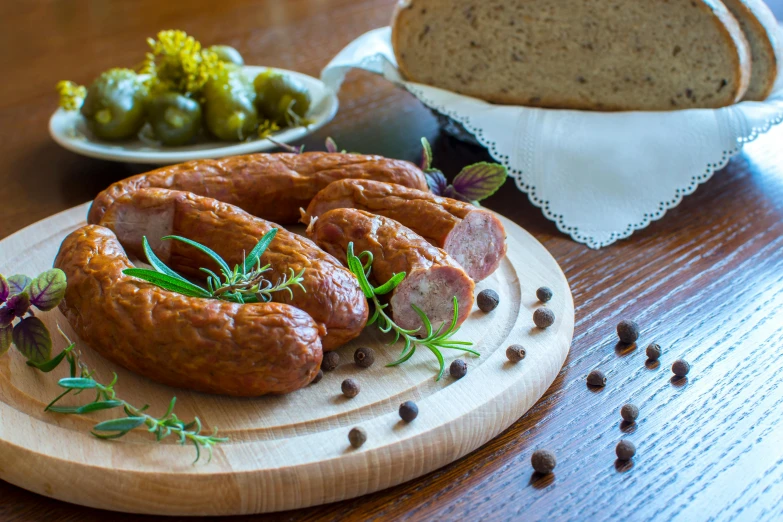 a close up of a plate of food on a table, sausages, bread, profile image, polish food