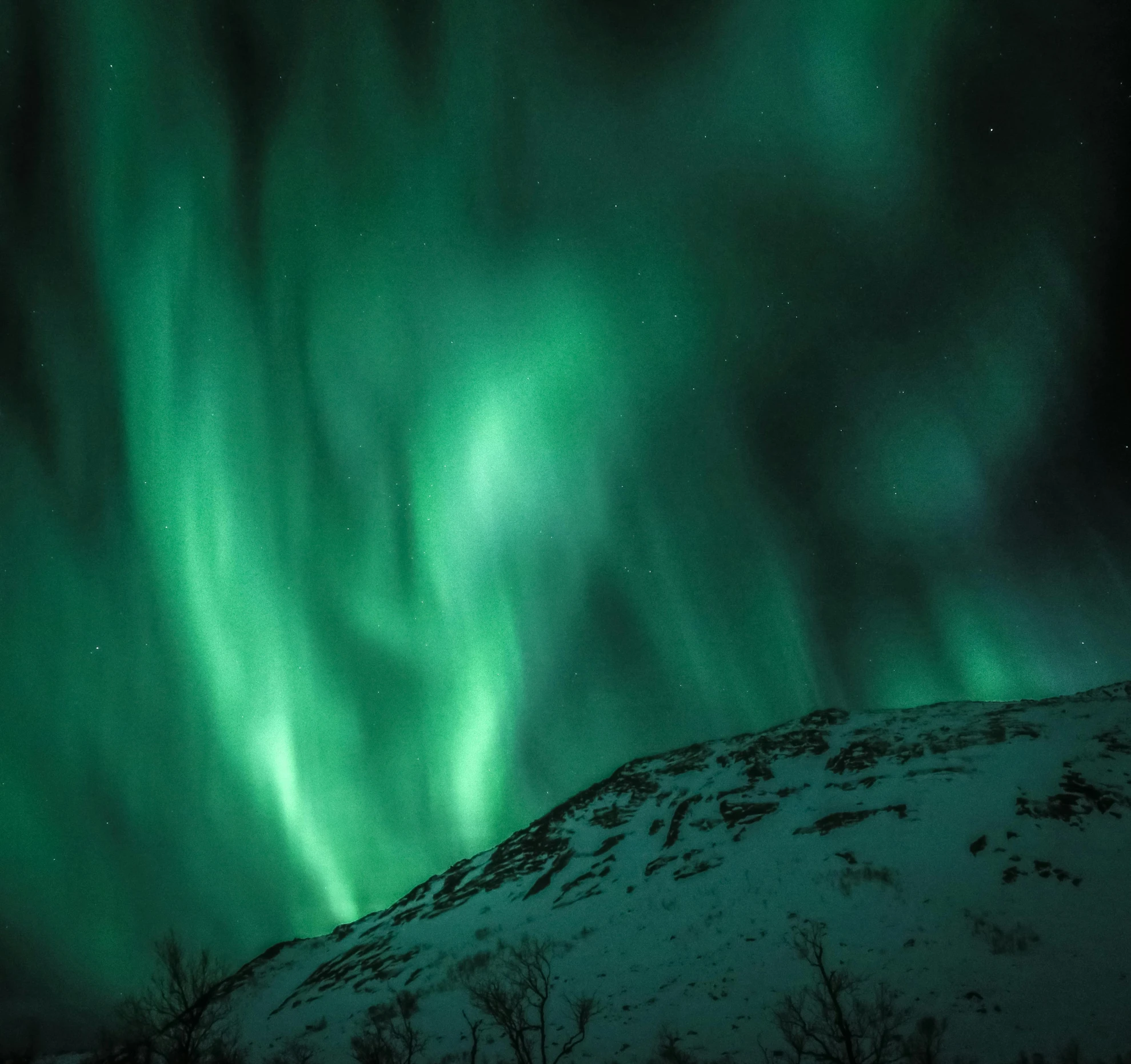 the aurora lights in the sky above a snow covered mountain, by Anato Finnstark, visual art, documentary photo, dark green, norse, set photo