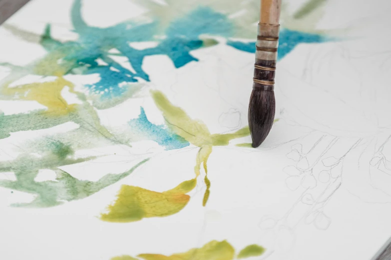 a close up of a paint brush on a piece of paper, a watercolor painting, inspired by Wu Changshuo, intricate plants, work in progress, detailed product image, ink and muted colours on silk