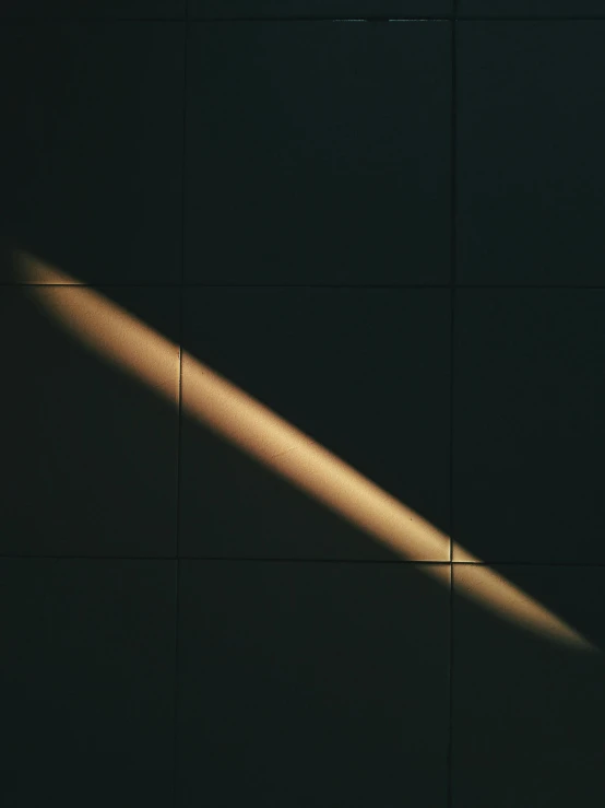 a shadow of a light on a wall, an album cover, by James Morris, unsplash, light and space, diagonal lines, moholy nagy, glowing light, single light