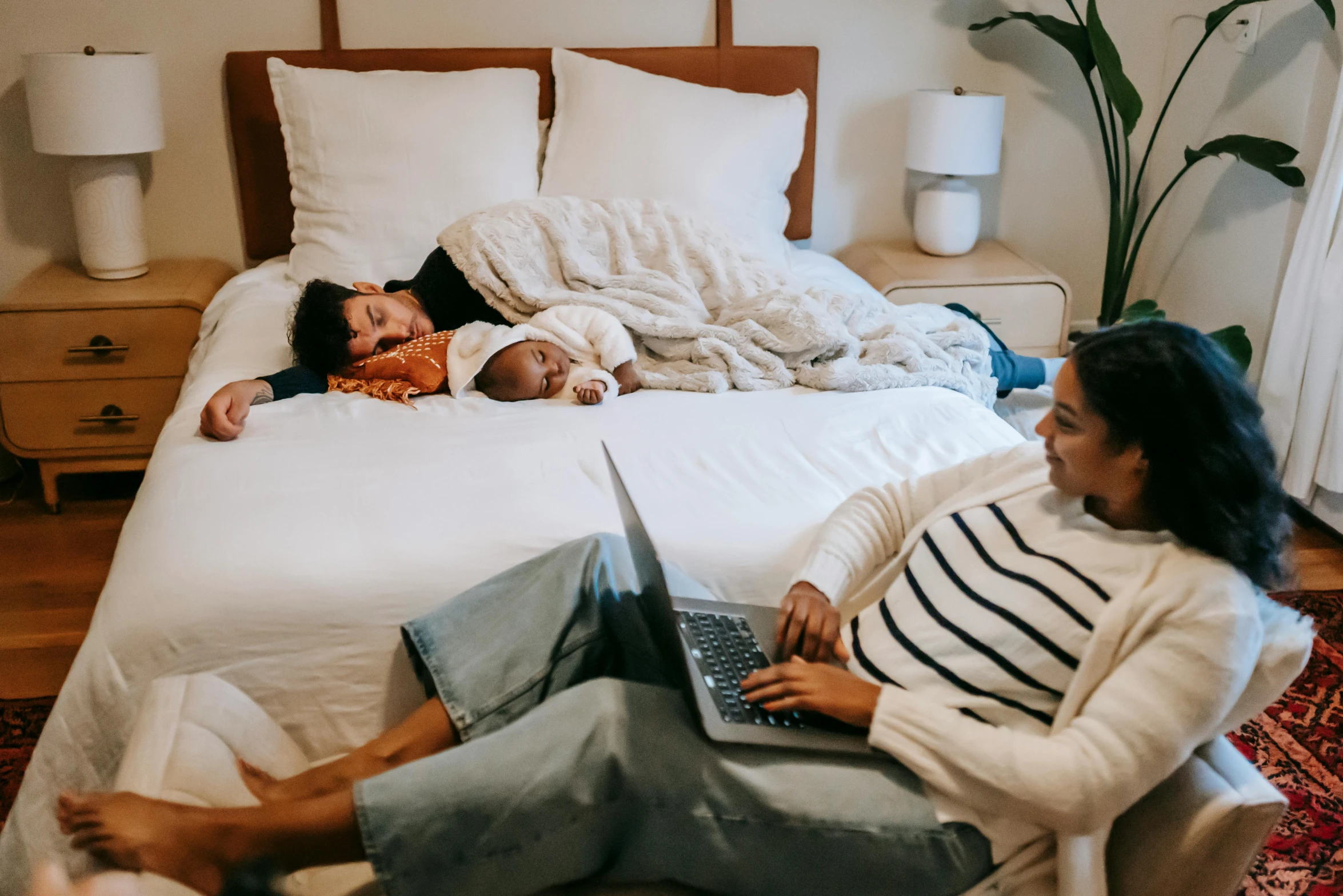 a couple of people laying on a bed with a laptop, by Carey Morris, pexels contest winner, families playing, nursing, 3 - piece, avatar image