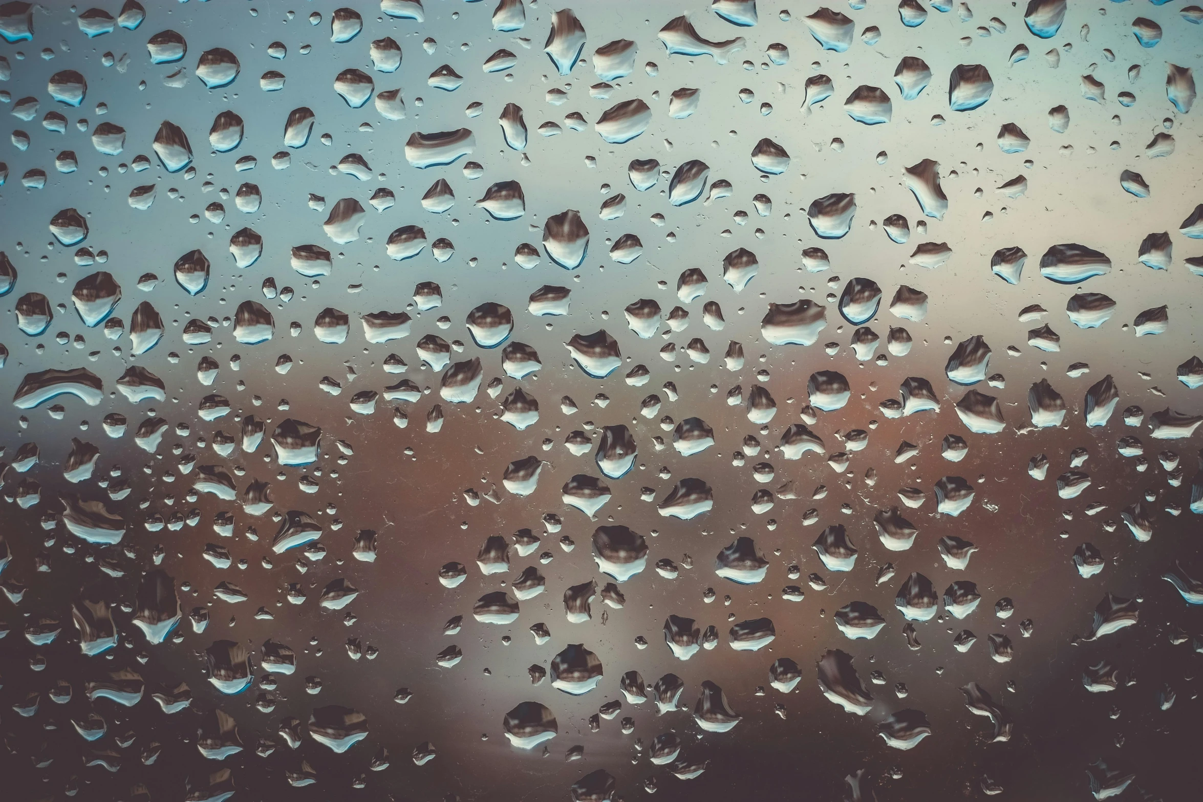 a close up of water droplets on a window, an album cover, inspired by Elsa Bleda, trending on unsplash, visual art, rainy day in minecraft, hyperdetailed, umbrellas, desktop wallpaper