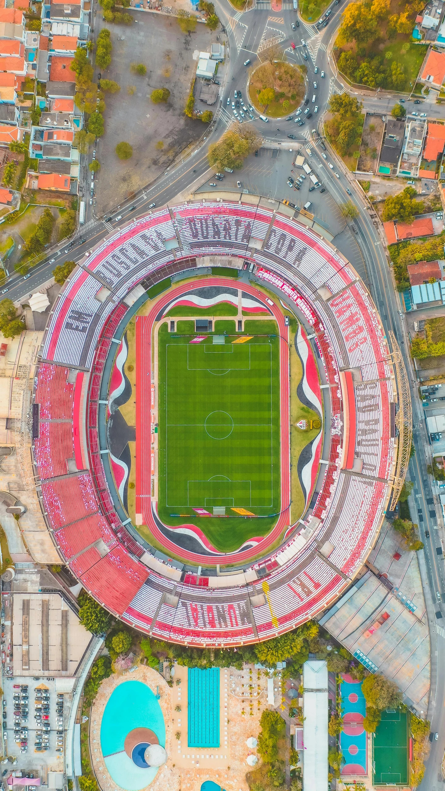 an aerial view of a soccer stadium, an album cover, inspired by Oswaldo Viteri, pexels contest winner, guanajuato, youtube thumbnail, 🚿🗝📝, neoprene