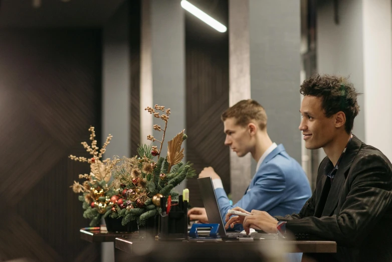 two men sitting at a table working on their laptops, by Sebastian Vrancx, pexels contest winner, renaissance, decorations, hotel room, lachlan bailey, avatar image