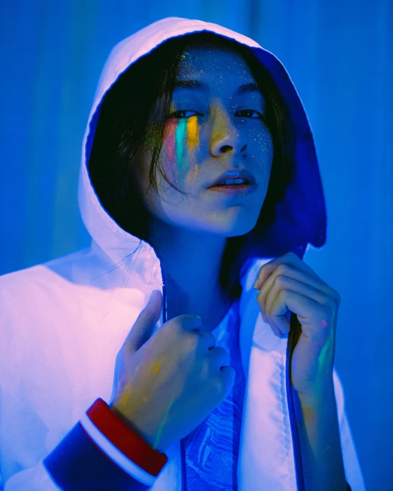 a close up of a person wearing a hoodie, inspired by Elsa Bleda, holography, kiko mizuhara, primary colors are white, bisexual lighting, promo image