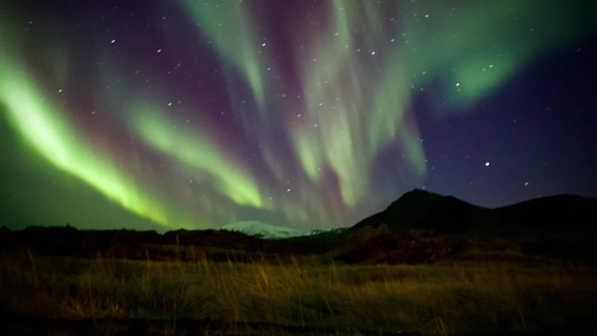 a green and purple aurora bore in the sky, by Sigrid Hjertén, hurufiyya, fan favorite, fall season, ap news photo, **cinematic