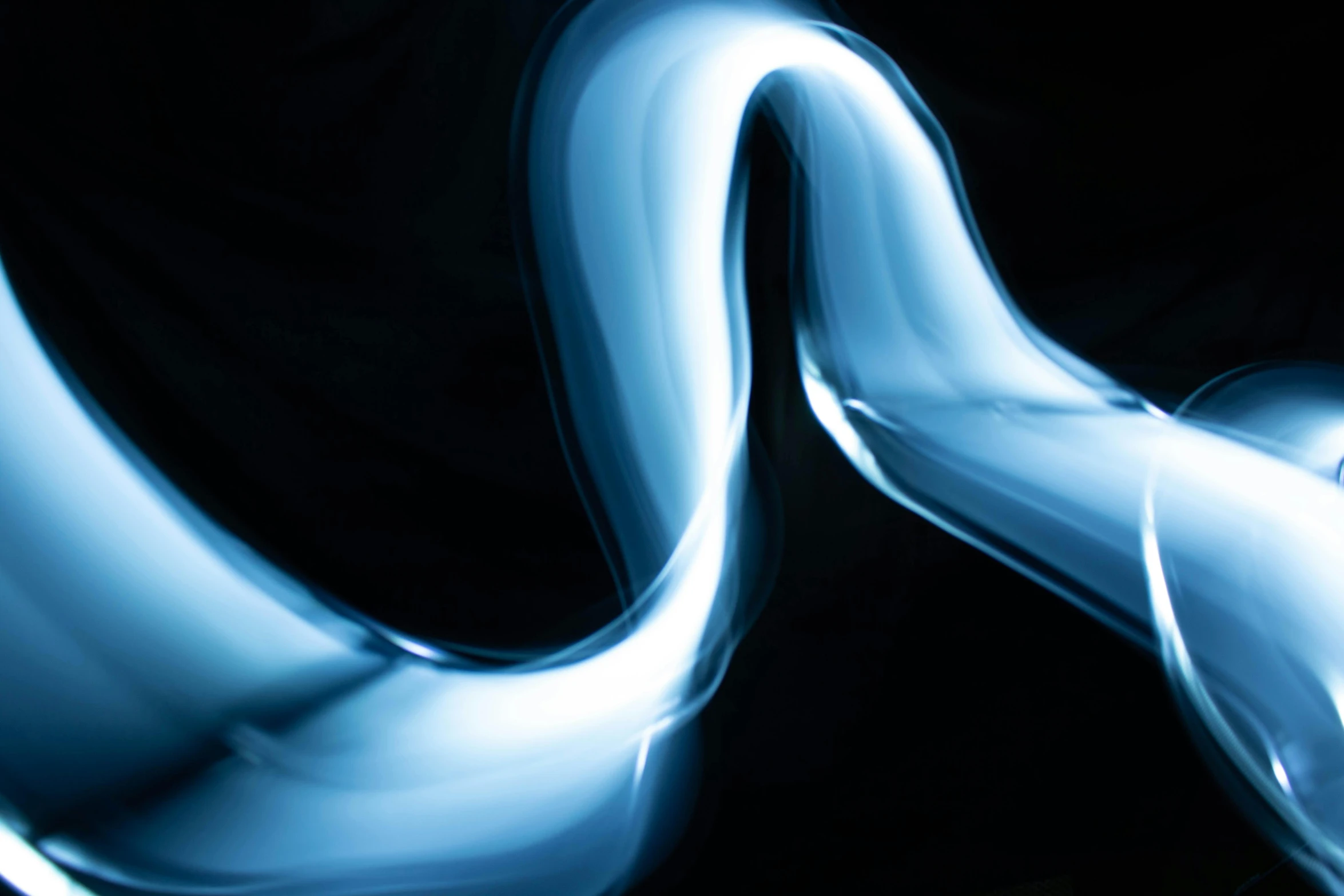 a close up of a light painting on a black background, inspired by Zaha Hadid, unsplash, lyrical abstraction, silver snakes, blue smoke, toothpaste refinery, glossy surface