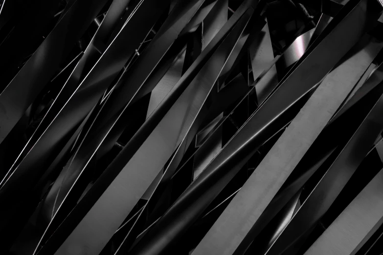 a black and white photo of a bunch of blades, inspired by Pierre Soulages, pexels contest winner, abstract illusionism, dark vibrant colors, cyberpunk metallic brackets, behance lemanoosh, lacquered