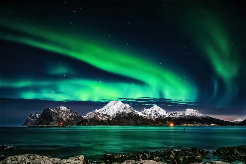 a large body of water with a mountain in the background, by Julia Pishtar, pexels contest winner, romanticism, northen lights background, national geographic ”, panels, threyda