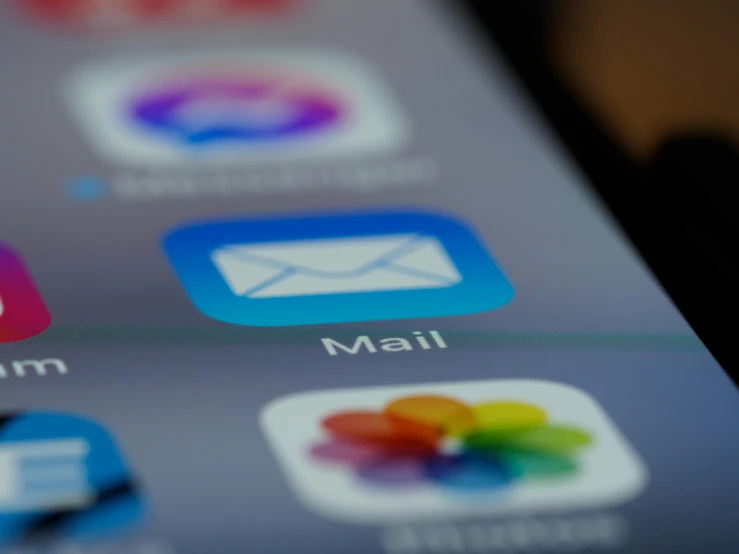 a close up of a cell phone with various app icons, by Matija Jama, pexels, delivering mail, slight blur, ios, email