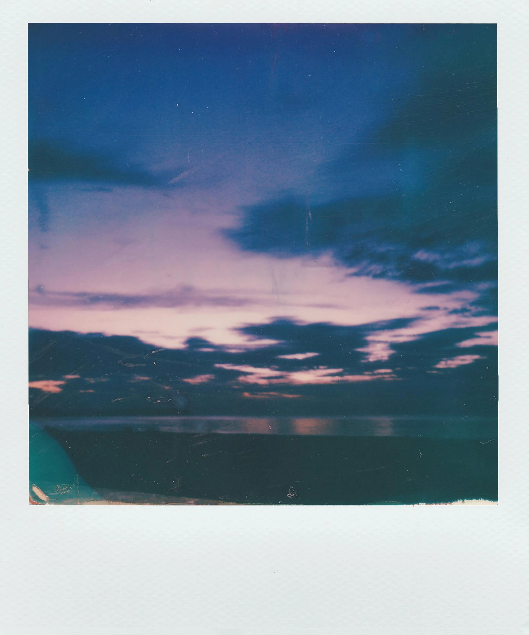 a polaroid picture of a sunset over a body of water, unsplash, hurufiyya, mauve and cyan, 256435456k film, multiple stories, clear image