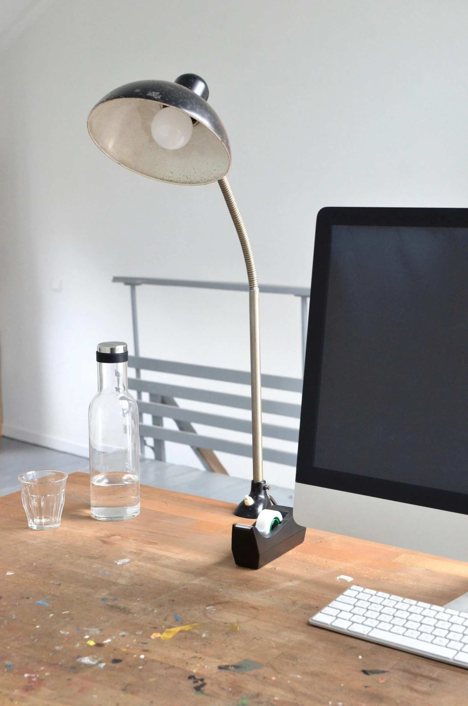 a computer monitor sitting on top of a wooden desk, inspired by Ceferí Olivé, happening, clamp shell lighting, bong, upcycled, experimental studio light