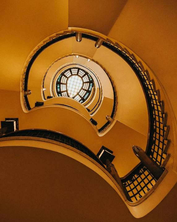 a spiral staircase with a stained glass window, an art deco sculpture, by Lubin Baugin, unsplash contest winner, yellow walls, dome, lgbtq, government archive