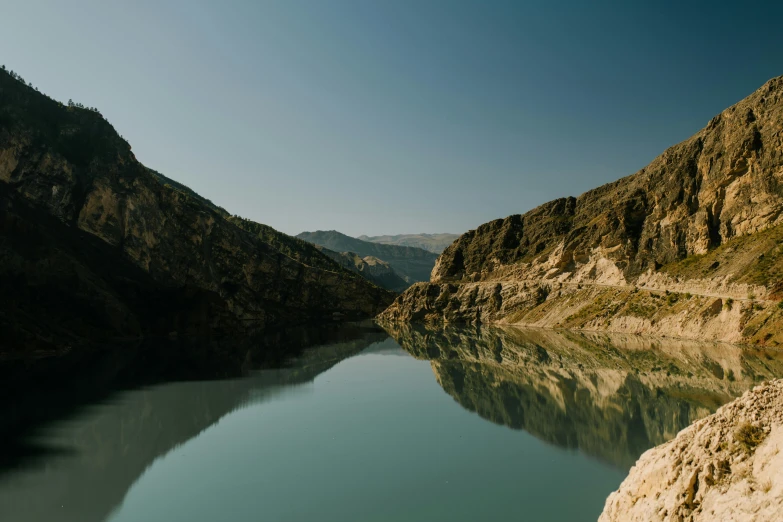 a large body of water surrounded by mountains, pexels contest winner, les nabis, cyprus, calm environment, high quality photo, conor walton