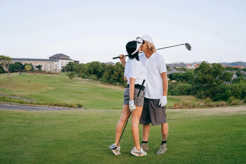 a man and woman standing next to each other on a golf course, by Lee Loughridge, pexels contest winner, happening, sydney park, playful vibe, thumbnail, romantic