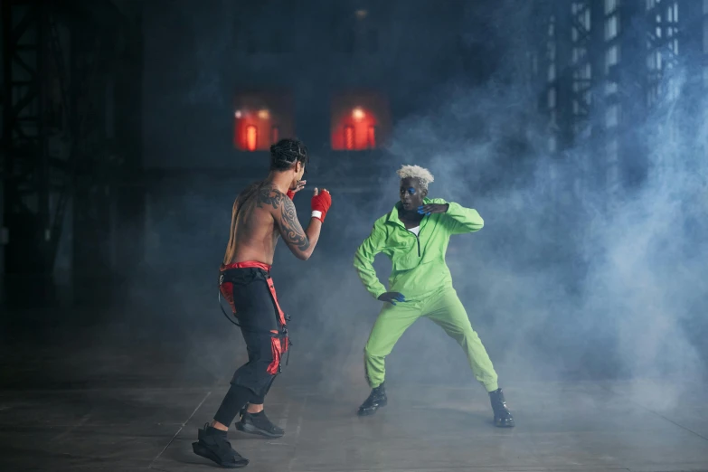 a couple of men standing next to each other on a stage, trending on pexels, ninjala, in a boxing ring, performing a music video, action with run and fight