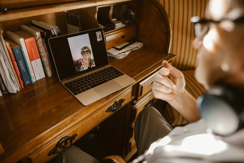 a man sitting in front of a laptop computer, a picture, by Julia Pishtar, pexels contest winner, long distance, calmly conversing 8k, the portrait of an elegant, youtube thumbnail