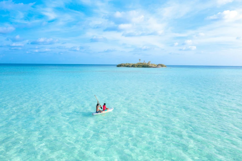 a couple of people riding on top of a boat in the ocean, crystal clear blue water, sup, white beaches, amanda lilleston