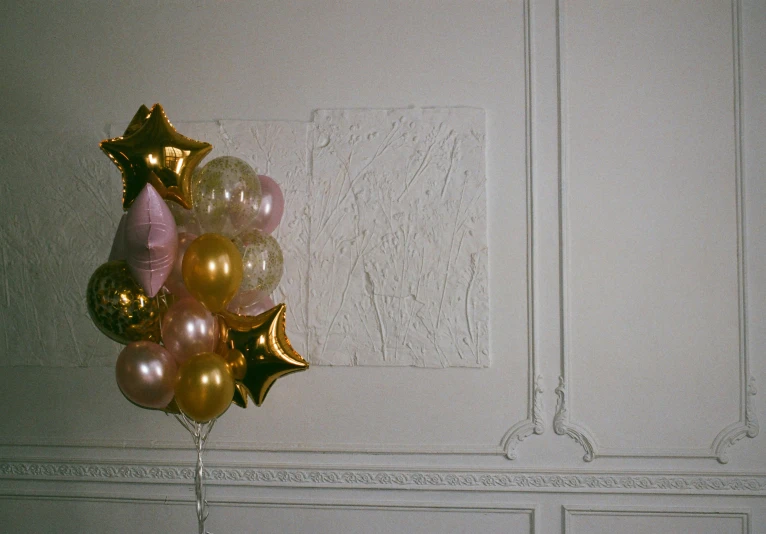 a bunch of balloons sitting on top of a table, an album cover, by Dulah Marie Evans, unsplash, hyperrealism, marble room, gilded relief, rinko kawauchi, maison ikkoku