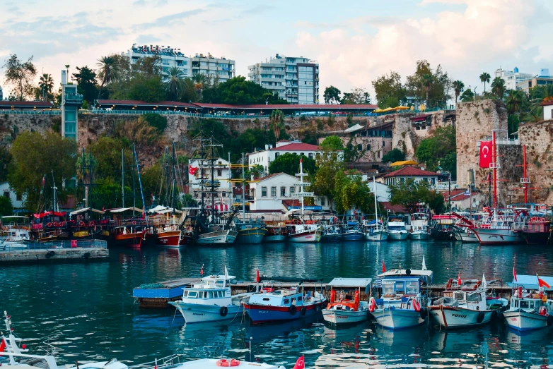 a number of boats in a body of water, by Niko Henrichon, pexels contest winner, hurufiyya, turkey, port scene background, thumbnail, scylla