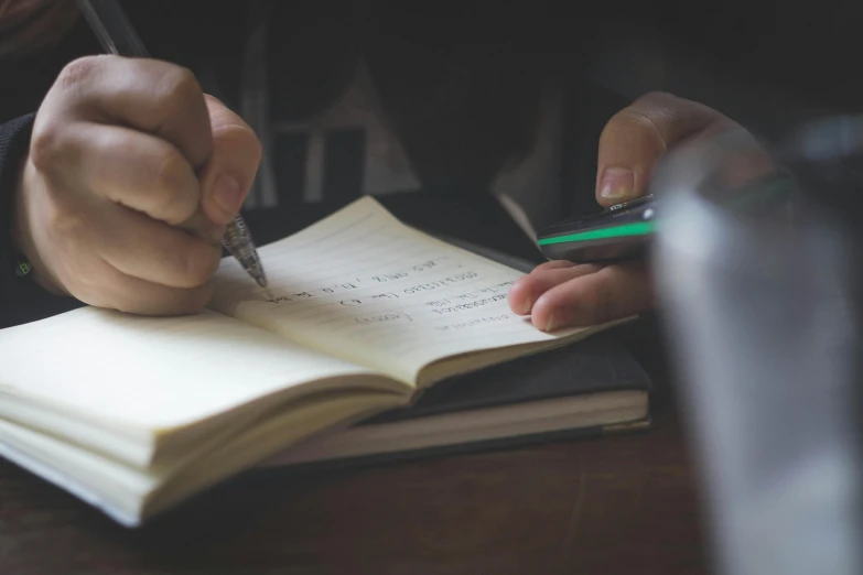 a person writing in a notebook with a pen, by Romain brook, pexels contest winner, academic art, from reading to playing games, thumbnail, private school, toned paper