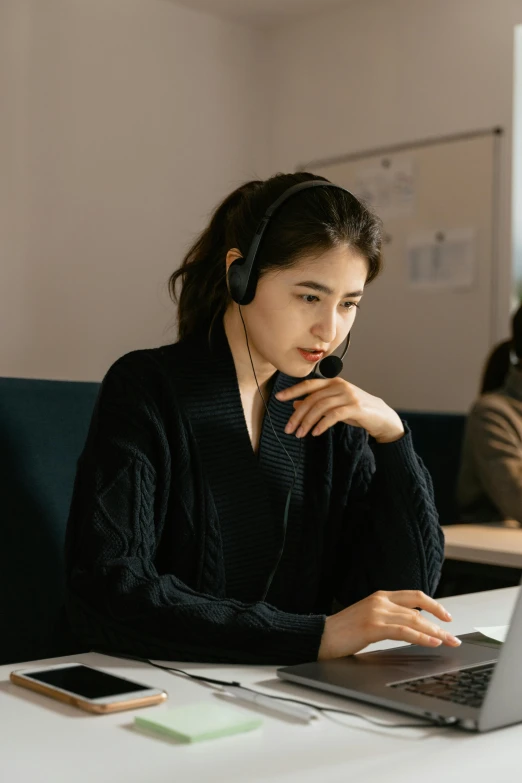 a woman sitting in front of a laptop computer, by Jang Seung-eop, trending on pexels, renaissance, working in a call center, kramskoi 4 k, ethnicity : japanese, avatar image