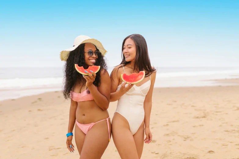 two women standing on a beach holding slices of watermelon, pexels contest winner, renaissance, ( brown skin ), closed swimsuit, avatar image, wavy lingeries