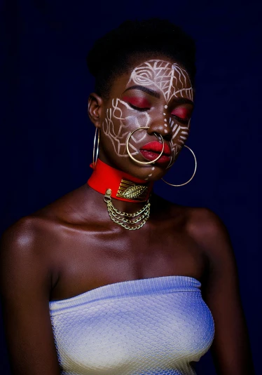 a woman with a tattoo on her face, an album cover, inspired by David Bailly, pexels contest winner, afrofuturism, gold detailed collar, warrior face painting red, wearing shipibo tattoos, modelling