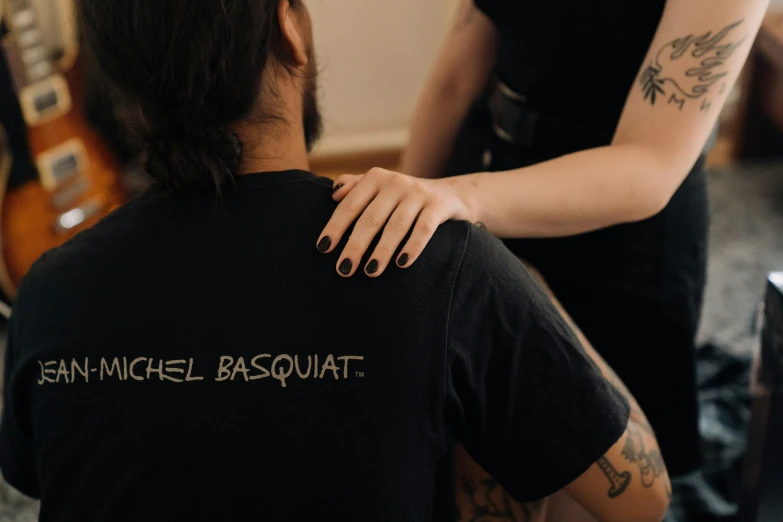 a woman getting her hair done at a salon, a tattoo, by Nina Hamnett, pexels contest winner, rasquache, jean michel basquiat, wearing a black shirt, bouguereau and bowater, back of hand on the table