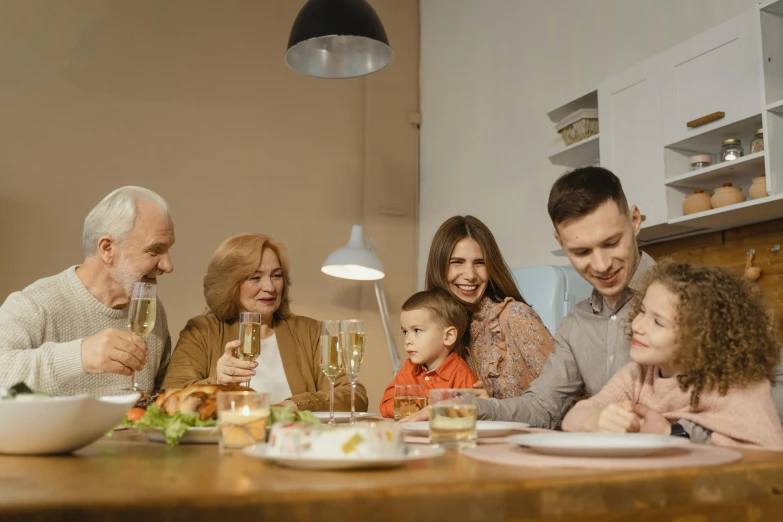 a group of people sitting around a wooden table, dinner table, profile image, family friendly, thumbnail