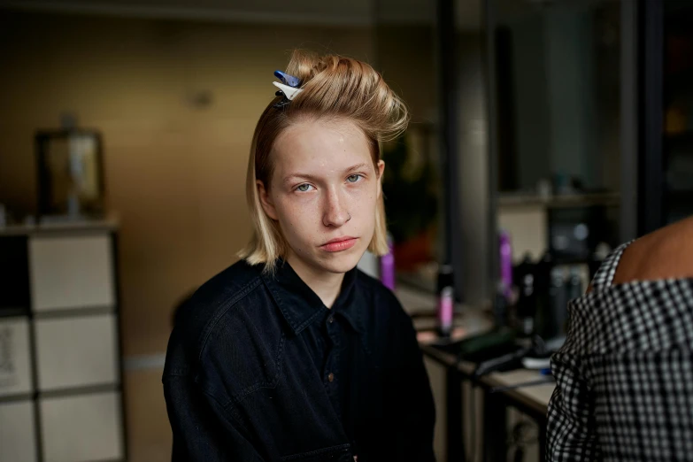 a woman getting her hair done at a salon, by Tobias Stimmer, trending on unsplash, hyperrealism, portrait androgynous girl, looking the camera, greta thunberg, 🤤 girl portrait