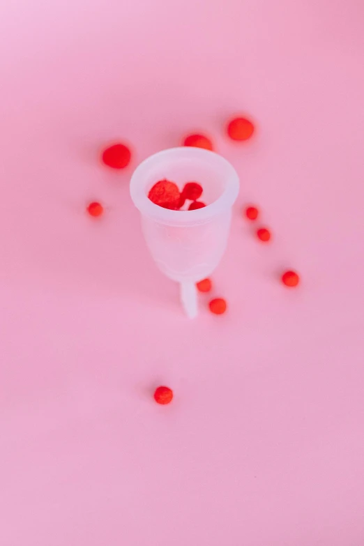 a plastic cup filled with cherries on a pink surface, by Jacob Toorenvliet, plasticien, surgical iv drip, raspberries, nsfw, 15081959 21121991 01012000 4k