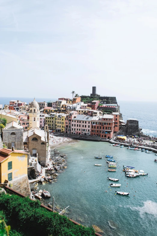 a group of boats floating on top of a body of water, by Patrick Pietropoli, pexels contest winner, renaissance, cliffside town, 4 k cinematic panoramic view, slide show, pastel'