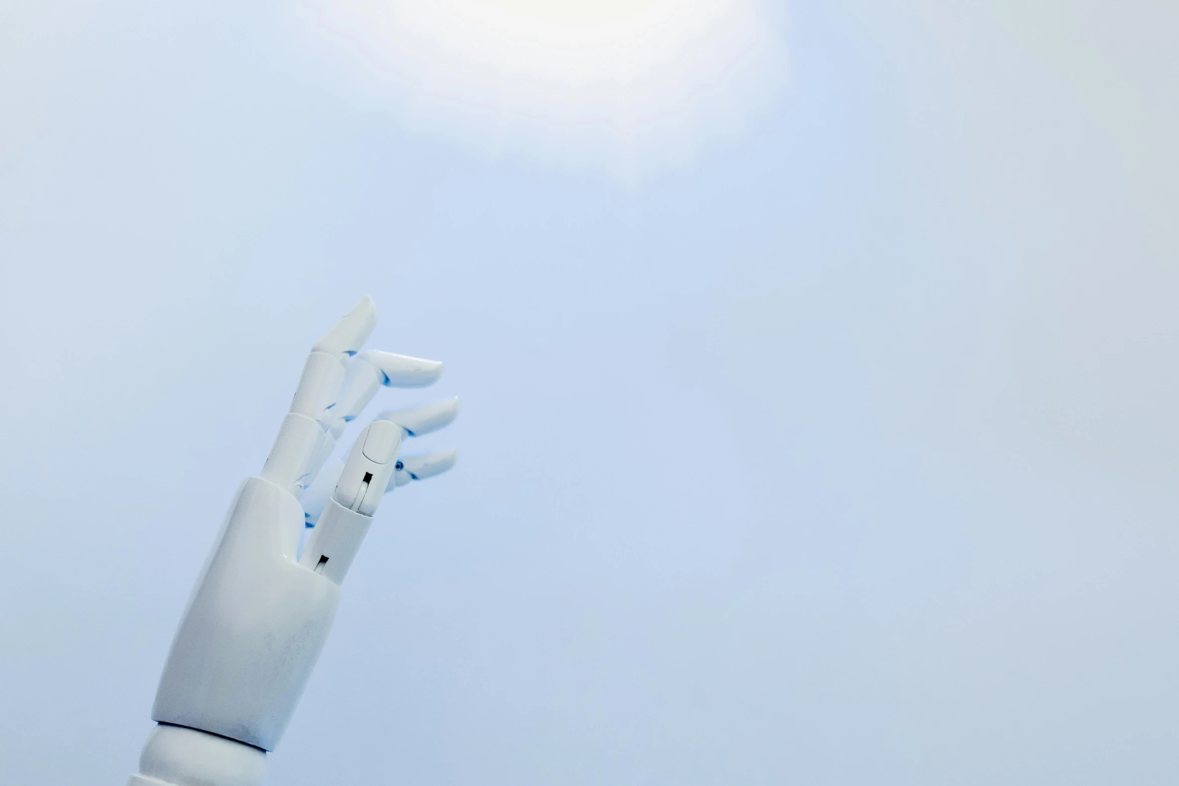 a robotic hand reaching up into the sky, unsplash, light blue skin, white, synthetic skin, hazy